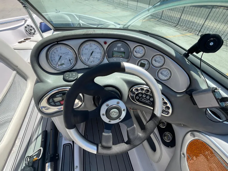 Slide: The Image of 2006 Nautique Air SV-211 Team dashboard with steering wheel and gauges. - 11