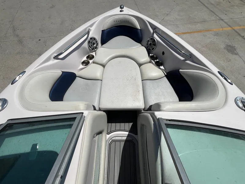 Slide: The Image of 2006 Nautique Air SV-211 Team boat interior with white and blue seating. - 12