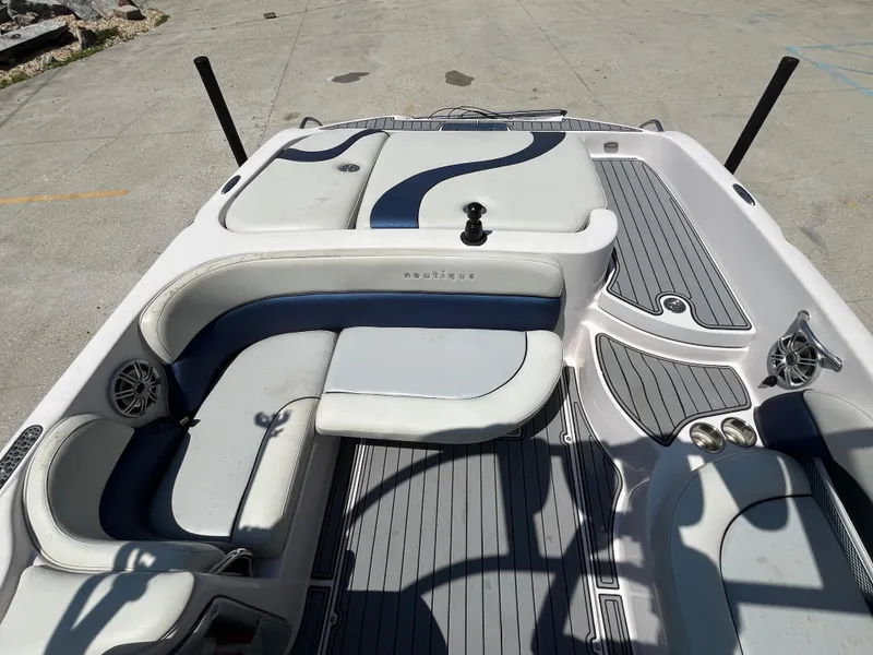 Slide: The Image of 2006 Nautique Air SV-211 Team boat interior with gray and blue seating and deck. - 14