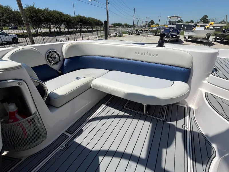 Slide: The Image of 2006 Nautique Air SV-211 Team boat interior with blue and white seating. - 15