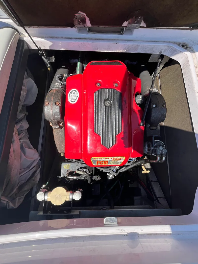 Slide: The Image of 2006 Nautique Air SV-211 Team boat engine with red cover, top view. - 17