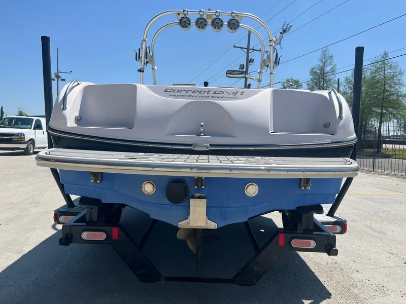 Slide: The Image of 2006 Nautique Air SV-211 Team boat, rear view, on trailer, sunny day. - 5