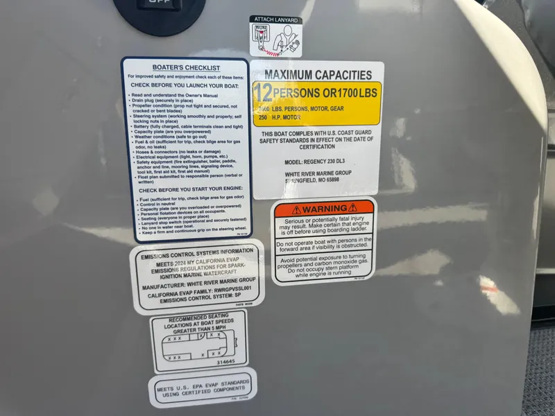 Slide: The Image of 2024 Regency 230 DL3 boat interior with luxurious gray seating and modern design. - 13