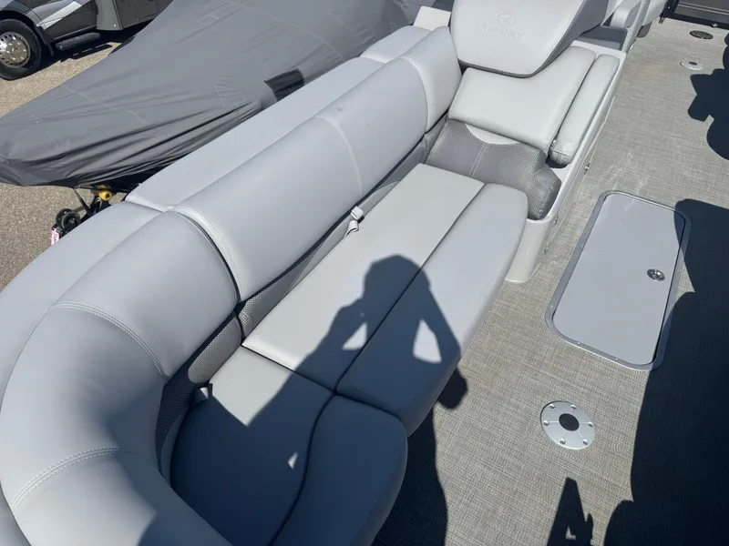 Slide: The Image of 2024 Regency 230 DL3 boat interior with plush gray seating and cup holders. - 7