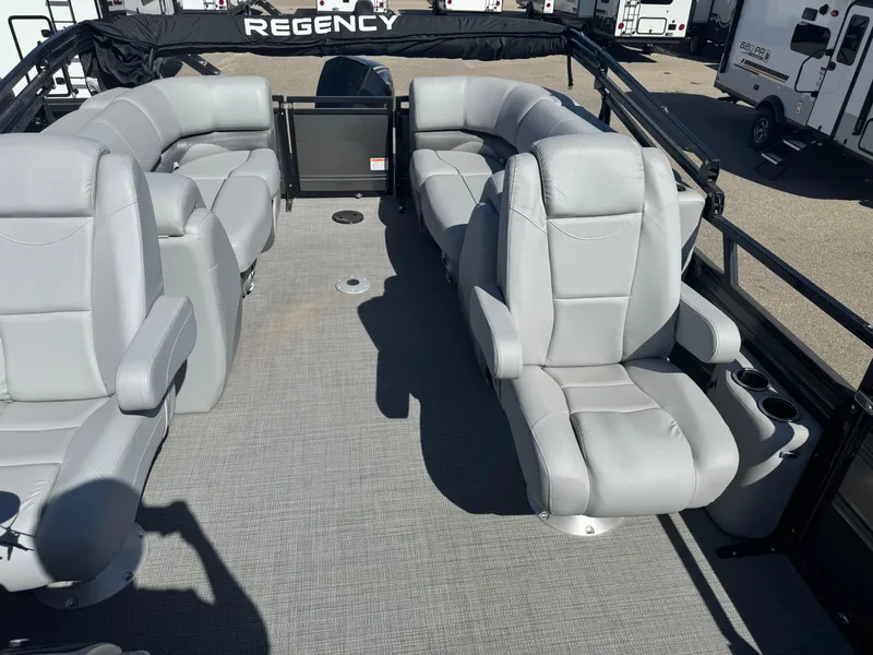 Slide: The Image of Luxurious seating in 2024 Regency 230 DL3 boat with cup holders and armrests. - 9