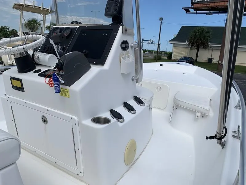 Slide: The Image of 2009 Sea King 198 Bay boat interior with steering console and seating. - 13