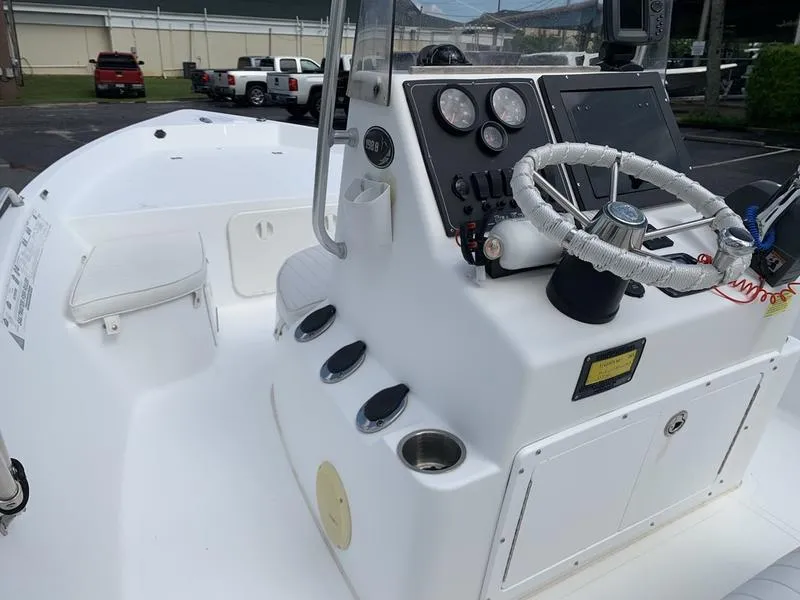 Slide: The Image of 2009 Sea King 198 Bay boat dashboard with steering wheel and control panel. - 14