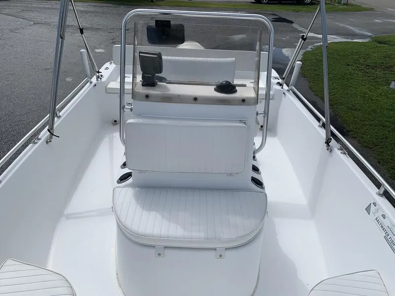 Slide: The Image of 2009 Sea King 198 Bay boat interior with white seating and console. - 16