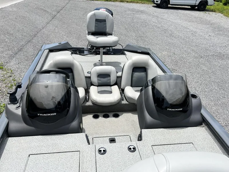 Slide: The Image of 2018 Tracker Pro Team 195 TXW boat interior with seating and console view. - 5