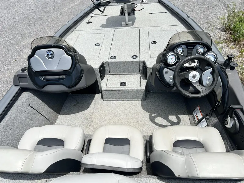 Slide: The Image of 2018 Tracker Pro Team 195 TXW boat interior with dual consoles and seating. - 7