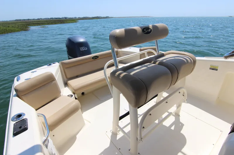 Slide: The Image of 2011 Scout 222 Sportfish boat interior with seating and ocean view. - 19