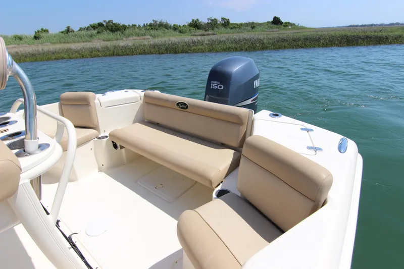 Slide: The Image of 2011 Scout 222 Sportfish boat with Yamaha 150 engine on calm water. - 21