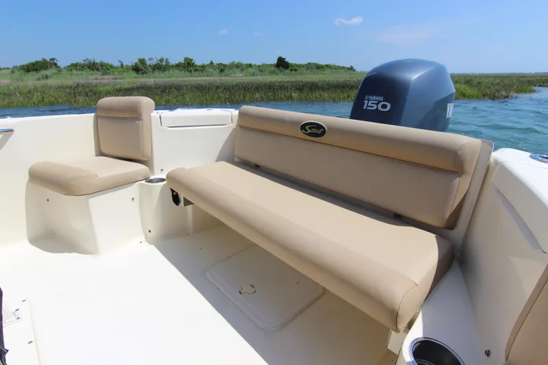 Slide: The Image of 2011 Scout 222 Sportfish boat interior with seating and Yamaha 150 engine. - 23