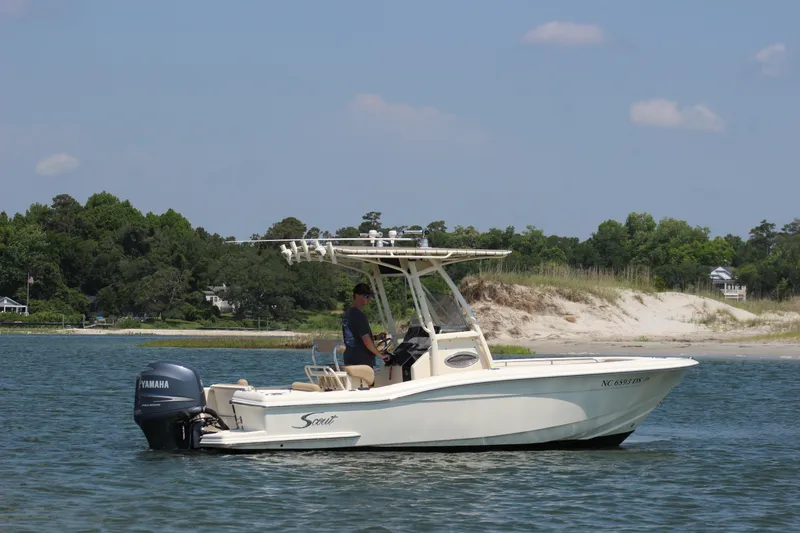 Slide: The Image of 2011 Scout 222 Sportfish boat on water with Yamaha outboard motor. - 6