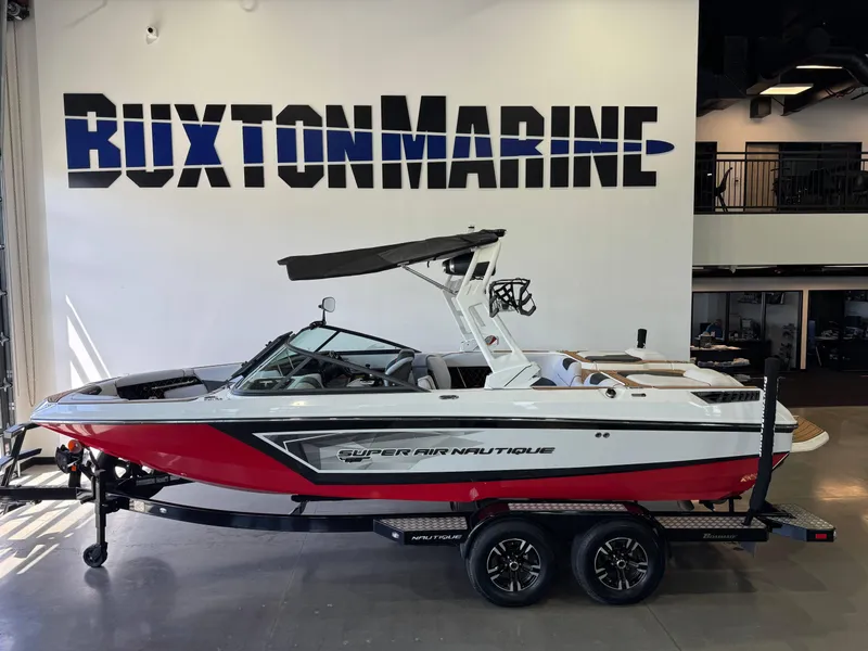 Slide: The Image of 2019 Nautique Super Air Nautique GS22 boat displayed at Buxton Marine showroom. - 1