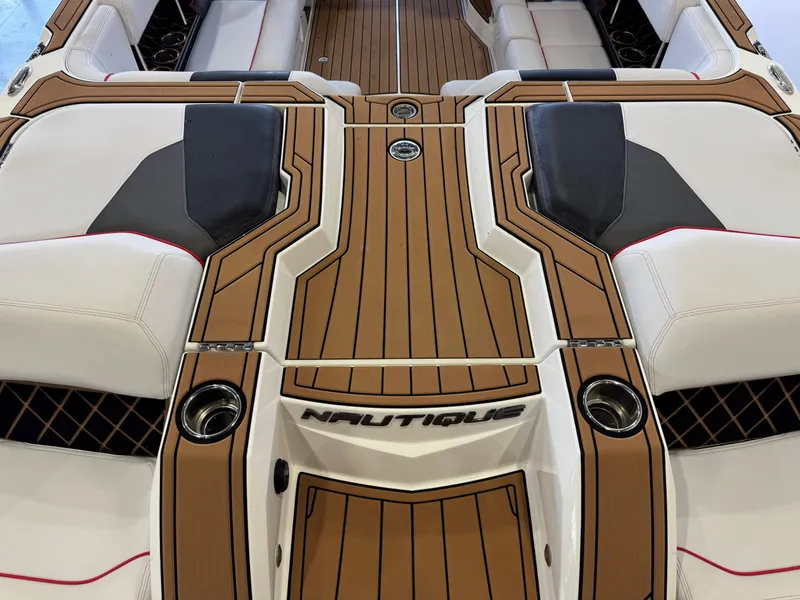 Slide: The Image of 2019 Nautique Super Air Nautique GS22 interior with stylish seating and wood accents. - 10
