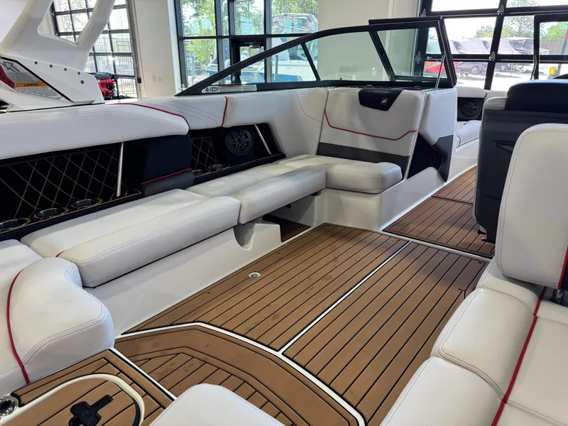 Slide: The Image of 2019 Nautique Super Air Nautique GS22 interior with white seating and wooden flooring. - 14