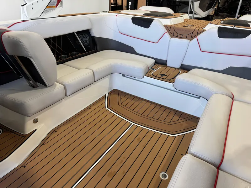 Slide: The Image of 2019 Nautique Super Air Nautique GS22 interior with white seating and teak flooring. - 15