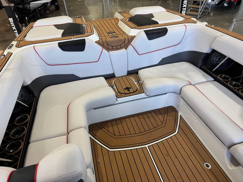 Slide: The Image of 2019 Nautique Super Air Nautique GS22 interior with white seating and teak flooring. - 17