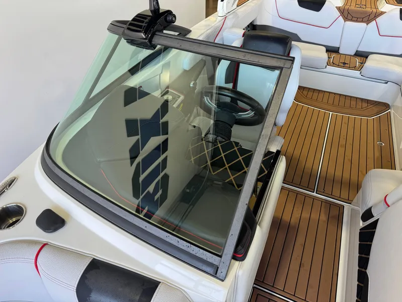 Slide: The Image of 2019 Nautique Super Air Nautique GS22 interior with sleek design and wooden flooring. - 21