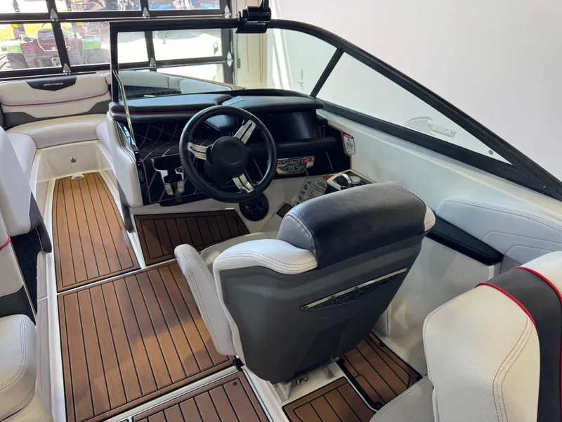 Slide: The Image of 2019 Nautique Super Air Nautique GS22 interior with sleek design and wood flooring. - 25