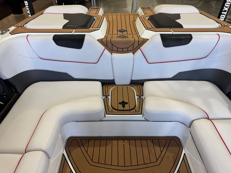 Slide: The Image of 2019 Nautique Super Air Nautique GS22 interior with white seating and teak flooring. - 28