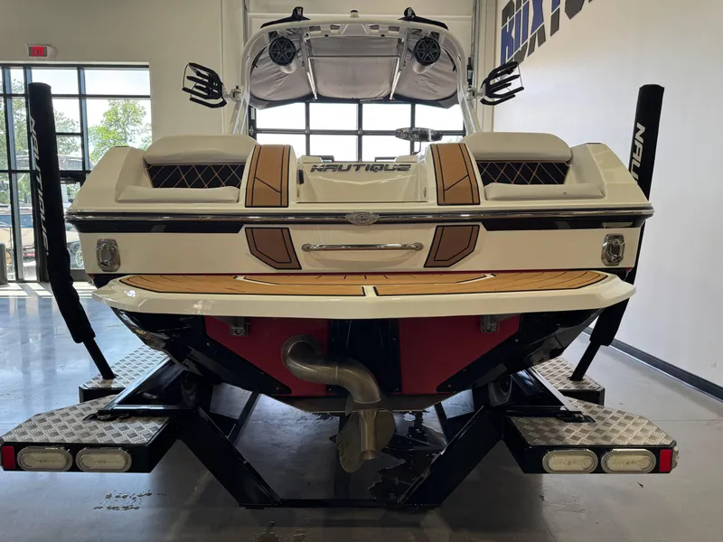 Slide: The Image of 2019 Nautique Super Air Nautique GS22 boat on trailer in showroom. - 6