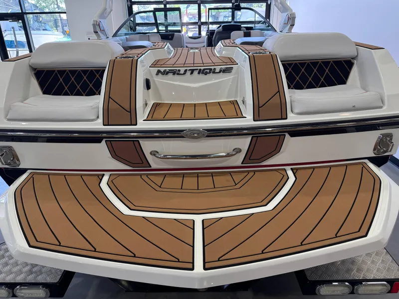 Slide: The Image of 2019 Nautique Super Air Nautique GS22 boat with stylish deck and seating. - 8