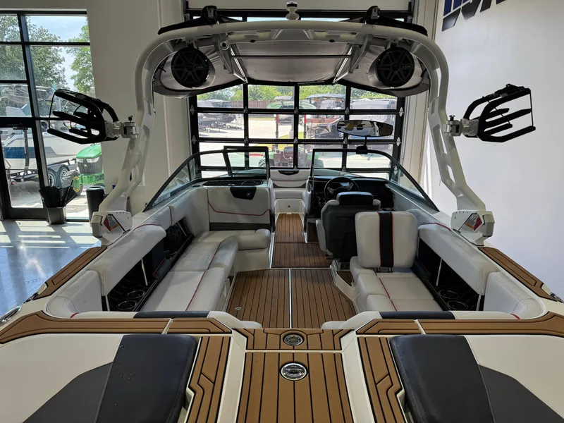 Slide: The Image of 2019 Nautique Super Air Nautique GS22 interior with sleek seating and advanced audio system. - 9