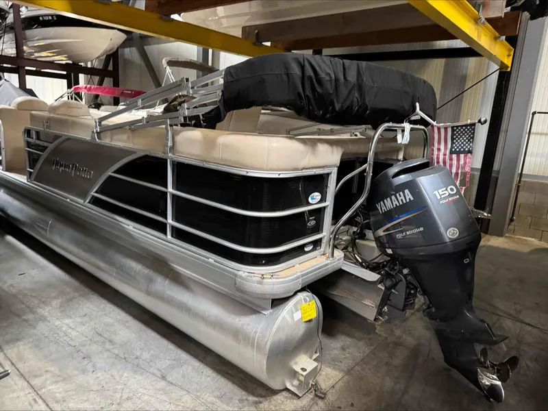 Slide: The Image of 2011 Godfrey Aqua Patio 240 pontoon boat with Yamaha 150 outboard motor in storage. - 3