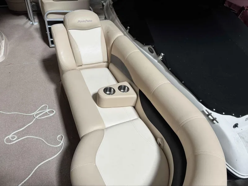 Slide: The Image of Luxurious seating on 2011 Godfrey Aqua Patio 240 boat with cup holders. - 9