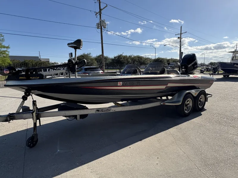 Slide: The Image of 2005 Bass Cat Cougar FTD boat on trailer in sunny outdoor setting. - 3