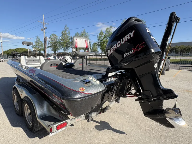 Slide: The Image of 2005 Bass Cat Cougar FTD boat with Mercury Pro XS engine, parked outdoors. - 9