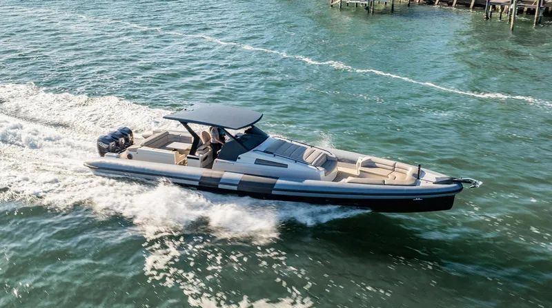 Slide: The Image of 2019 Chaser 500R boat cruising on open water, showcasing sleek design and powerful engines. - 0