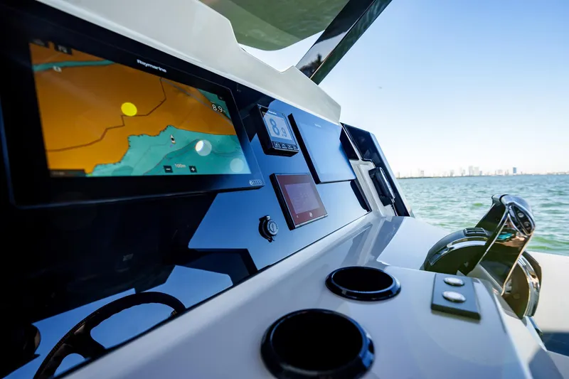 Slide: The Image of Dashboard of 2019 Chaser 500R boat with navigation screens, ocean view. - 10