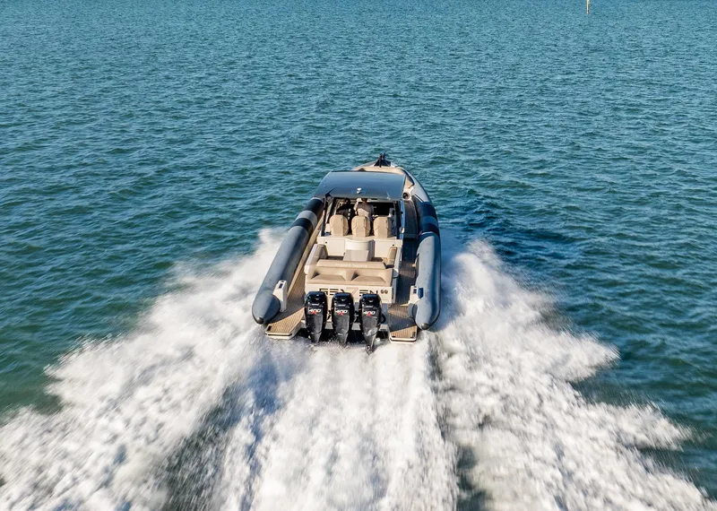 Slide: The Image of 2019 Chaser 500R speedboat cruising on open water, rear view. - 4