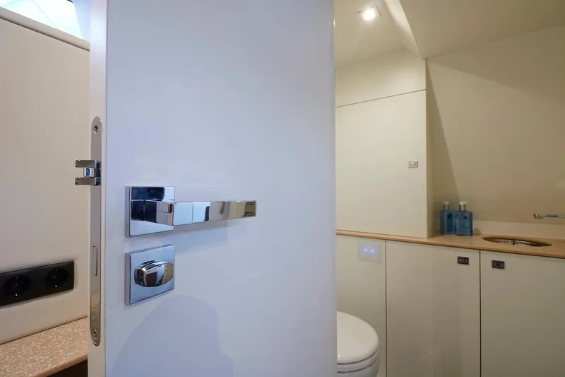 Slide: The Image of Modern bathroom interior on 2019 Chaser 500R yacht, featuring sleek design and chrome fixtures. - 7