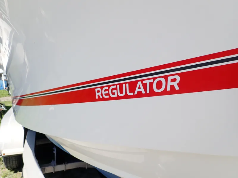 Slide: The Image of 2020 Regulator 23 boat with red stripe and logo on hull. - 3
