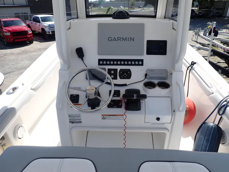 Slide: The Image of 2020 Regulator 23 boat console with Garmin navigation system and steering wheel. - 4
