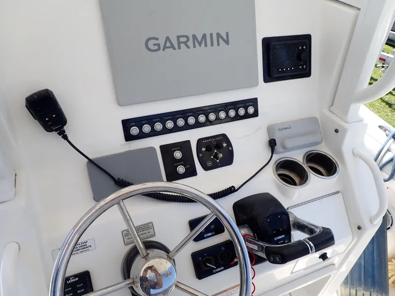 Slide: The Image of 2020 Regulator 23 boat console with Garmin electronics and steering wheel. - 6