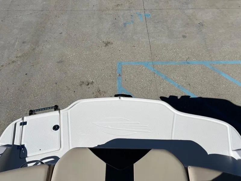 Slide: The Image of 2017 Chaparral H20 boat deck, beige seating, and textured flooring. - 18