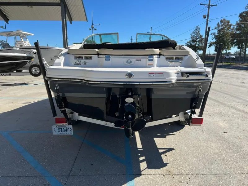 Slide: The Image of 2017 Chaparral H20 boat, rear view, parked outdoors on a sunny day. - 3