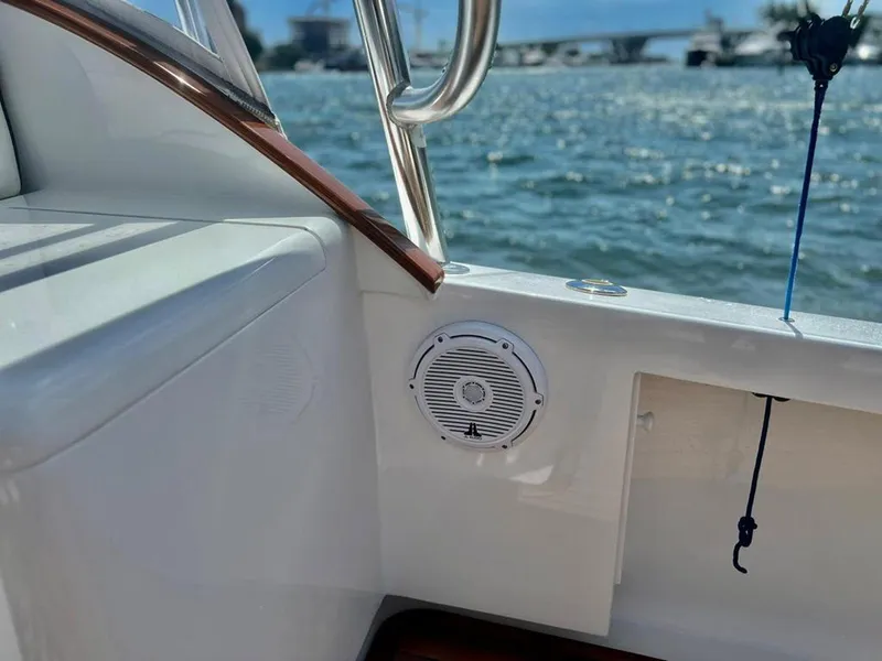 Slide: The Image of 1999 Gamefisherman 34 Express boat interior with speaker, overlooking water and distant bridge. - 11