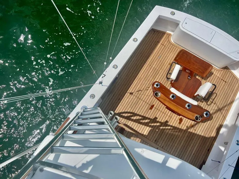 Slide: The Image of Overhead view of 1999 Gamefisherman 34 Express yacht deck with fishing chair. - 19