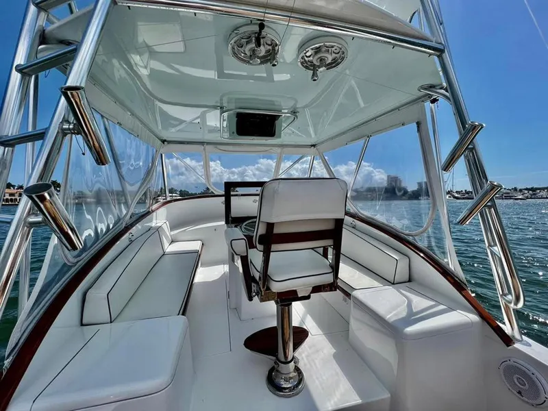 Slide: The Image of 1999 Gamefisherman 34 Express boat interior with helm, seating, and ocean view. - 4