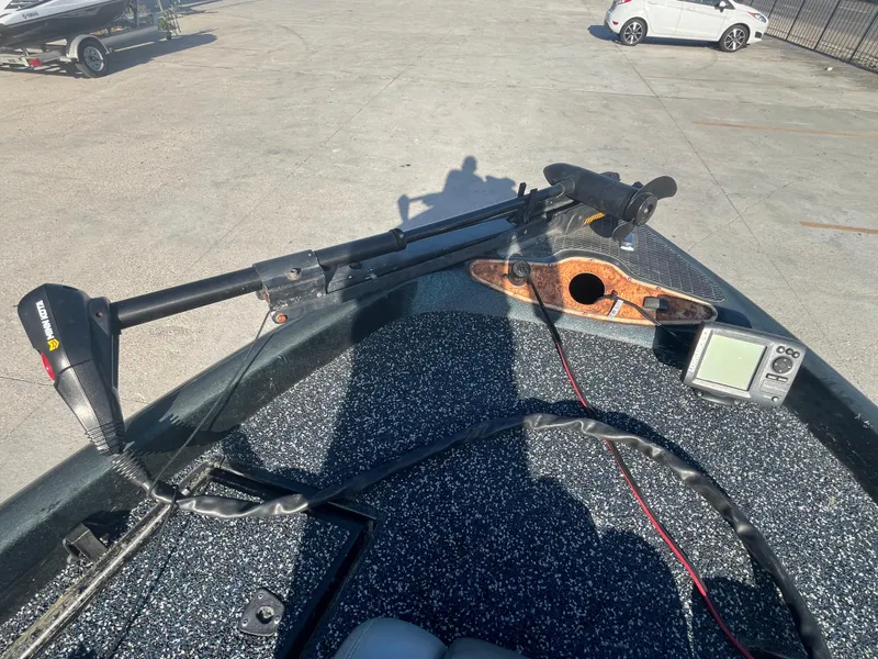 Slide: The Image of 1998 Triton Tr-17 boat deck with trolling motor and fish finder. - 10