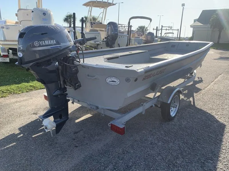 Slide: The Image of 2025 SeaArk DXS 1548 DKLD boat with Yamaha outboard motor on trailer. - 4