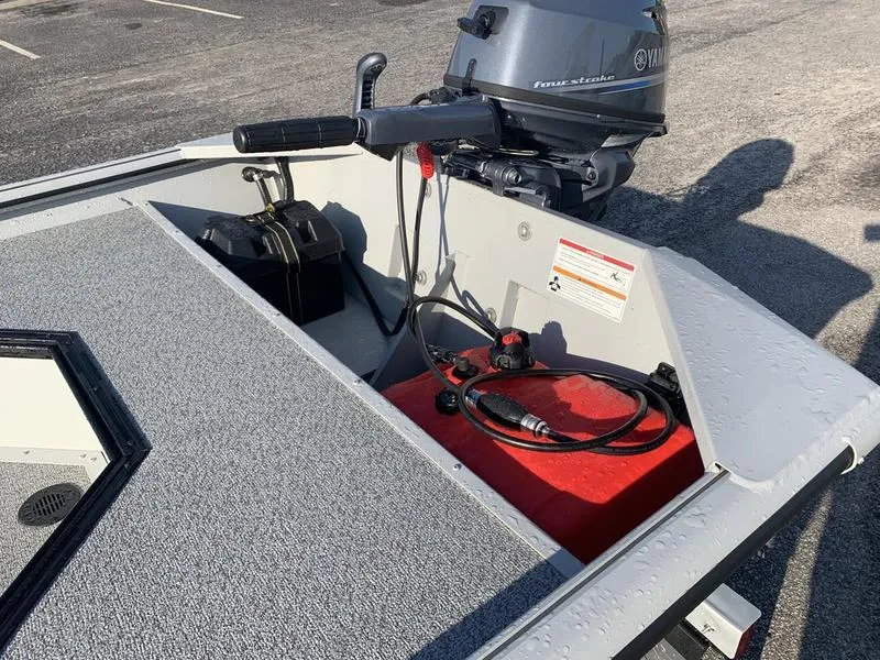 Slide: The Image of 2025 SeaArk DXS 1548 DKLD boat with Yamaha outboard motor and red fuel tank. - 9