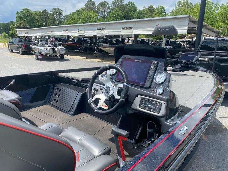 Slide: The Image of 2022 Nitro Z20 Pro boat interior with steering wheel and control panel. - 3