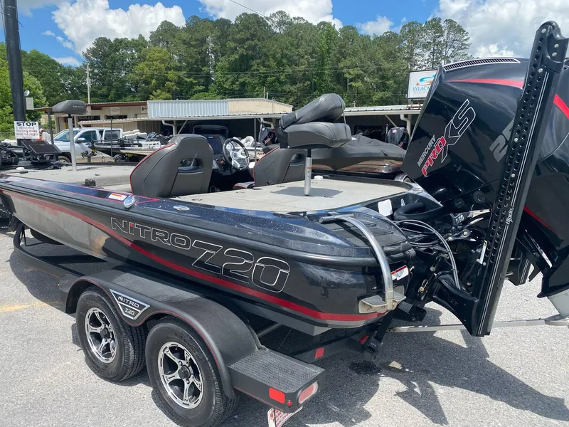 Slide: The Image of 2022 Nitro Z20 Pro boat with dual seats and powerful engine, parked outdoors. - 6